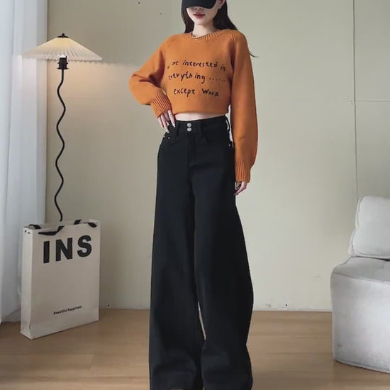 YEEYEEWang Wide-Leg jeans video in Solid Black: Asian model walks showing drapey wide-leg fit, camera zooms to double-button high waist and cuffed hems as she lifts the leg to show details.