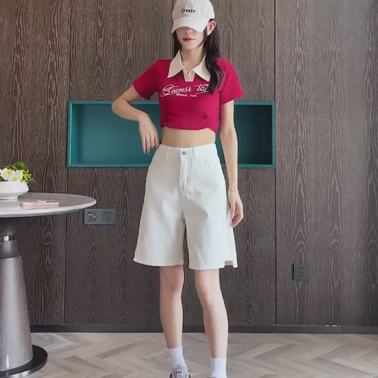 YEEYEEWang Denim Bermuda Shorts video in White: Asian model strides, poses and spins to display high-waist double-button fit, side-slit hems, daisy-embroidered back pockets in a modern room.