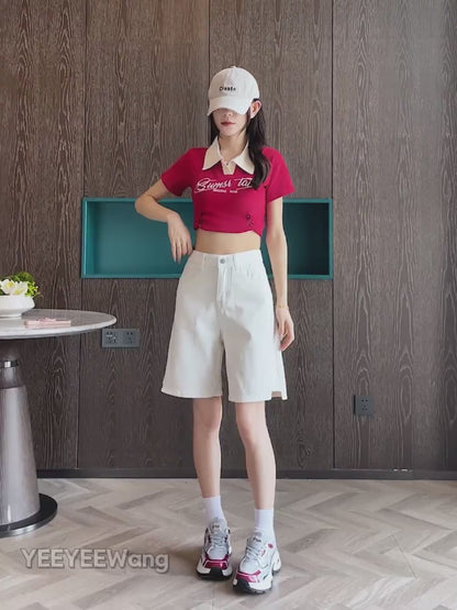 YEEYEEWang Denim Bermuda Shorts video in White: Asian model strides, poses and spins to display high-waist double-button fit, side-slit hems, daisy-embroidered back pockets in a modern room.