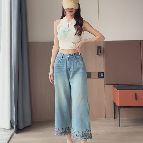 YEEYEEWang Straight jeans in Vintage Blue video: Asian model walks and poses in high-waist wide-leg jeans, showing drape, floral embroidered hems and faded wash under natural light.