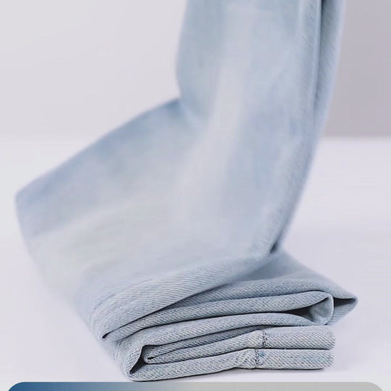 YEEYEEWang Wide-Leg jeans video in Light Blue: camera pans down Asian-fit wide-leg cut to wide stitched hems, close-ups of fabric, button, zipper, pockets, scratch and wrinkle tests, stitching details.