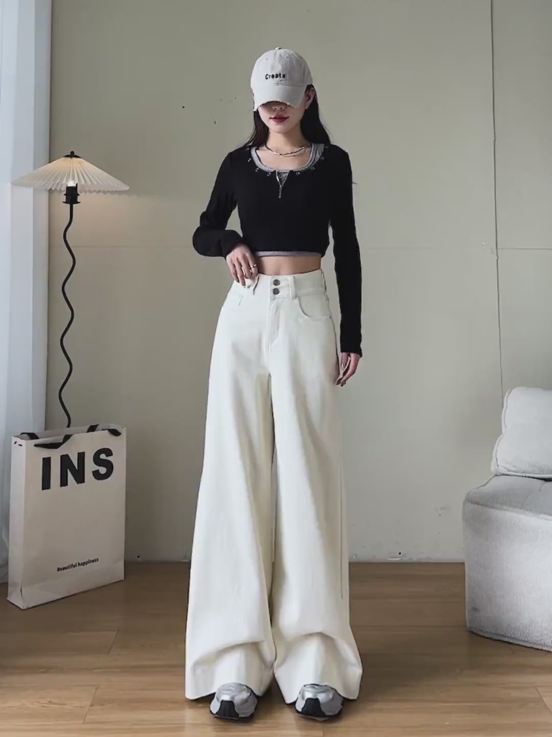 YEEYEEWang Wide-Leg jeans video Fleece-Lined in Ivory: Asian model stands, pockets hands and lifts leg showing floor-length drapey fit, camera zooms to double-button high waist and warm fleece feel.