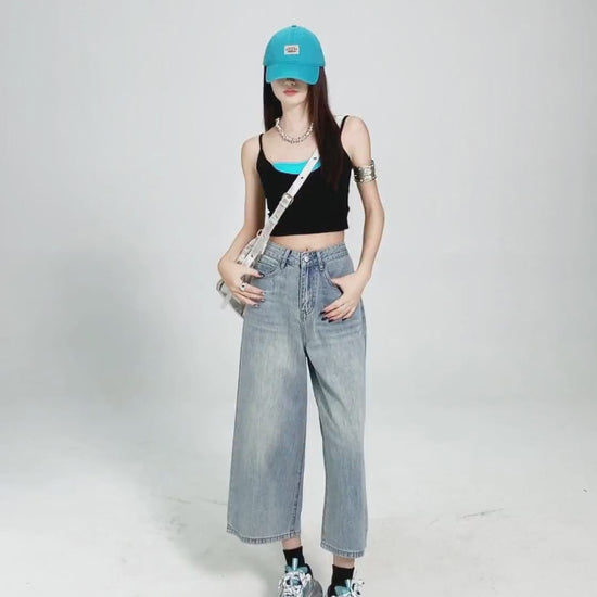 YEEYEEWang Wide-Leg jeans in Light Blue video, Asian model poses in white studio as camera zooms to waist and back pockets, showing fabric drape